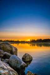 Sunset evening along the rocky seacoast ocean seashore.