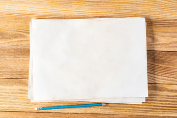 Sheet of paper lying on wooden table