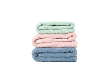 Stack of colored towels isolated on white background