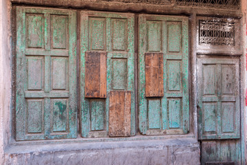 green wooden door in marrakech