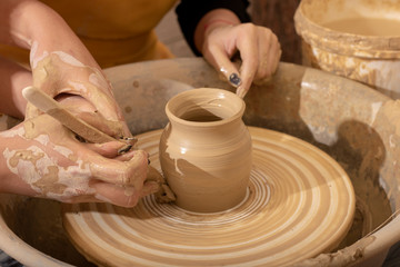 Teaching child to make potter jar, pottery.
