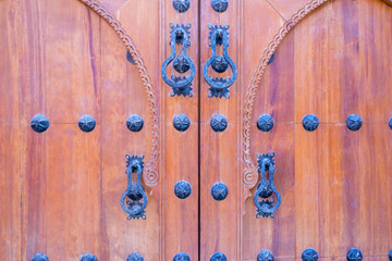 brown arabic style wooden door in marrakech
