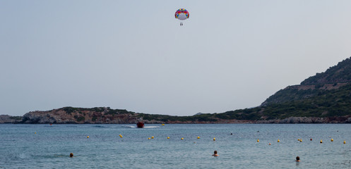 Parasail wing pulled by a boat. Sea summer recreation.Bali,CRETE