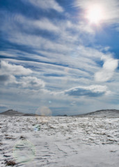 clouds over a winter landscape