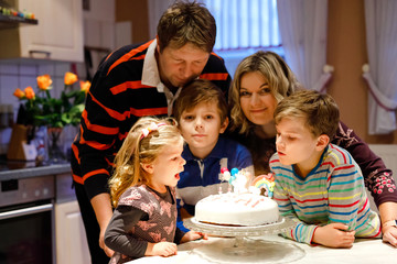 Adorable little toddler girl celebrating third birthday. Baby child, two kids boys brothers, mother...