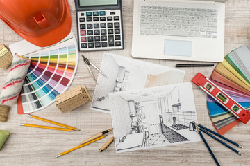 Top view of architects  drawing modern house with sample material, hardhat, laptop on creative...