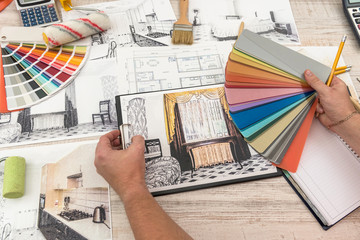 The designer chooses the perfect color for a new apartment. Sketch of a modern apartment.