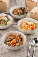 asian take out food different noodles with box on grey table
