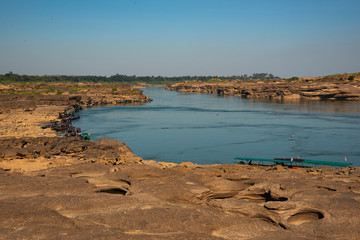 view of river and rock with blue sky