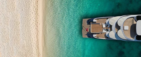 Fotobehang Aerial drone top view ultra wide photo of luxury yacht docked near exotic sandy turquoise beach © aerial-drone