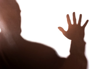 Hand old man covers his face, protest - silhouette, concept