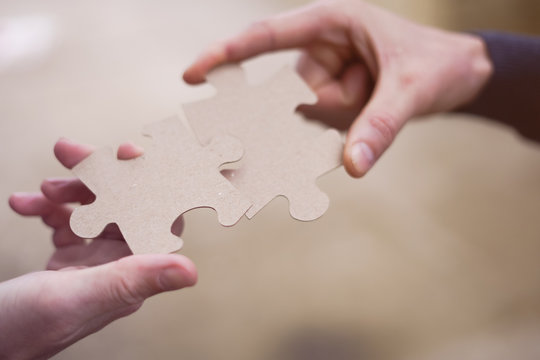 Cooperation puzzle partnership teamwork job business strategy.