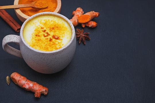 Detox turmeric latte, golden milk drink in a mug