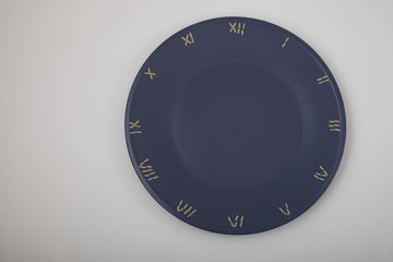 clock, time concept with rice on a blue plate, top view