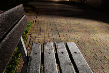 The first frost. A bench in hoarfrost.