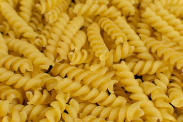 background formed by spiral shaped pasta