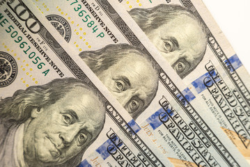 100 dollars bills close-up and portrait of Benjamin Franklin on US cash bill