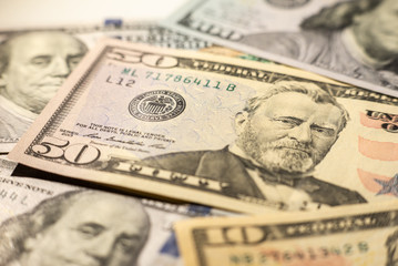 Close up of different dollar bills as background. Amarican dollars pattern. Top view of business concept.