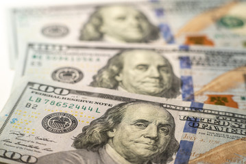 100 dollars bills close-up and portrait of Benjamin Franklin on US cash bill