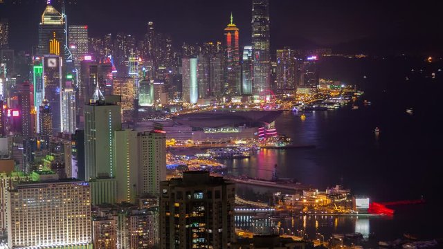 Hong Kong urban cityscape aerial skyline panorama timelapse at night pan up