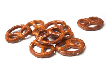 Closeup of salted pretzels on white background