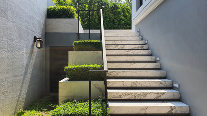 White marble stairs and plant pots.