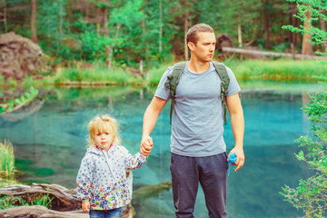 dad with child in the woods