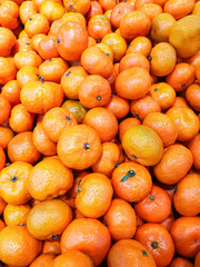 group of fresh orange fruits in supermarket full frame for sale