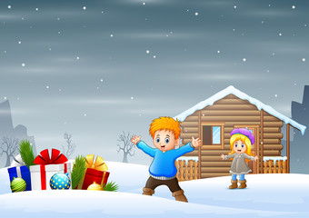 Happy children with many box gifts on snowy outdoors