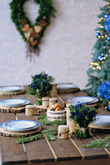 Beautiful New Year's interior in rustic style. Table decoration for the New Year holiday.