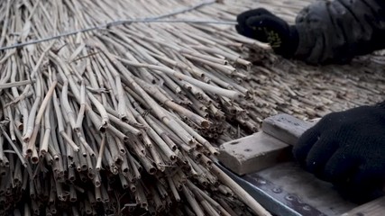 Reed roof. The master makes reed roof.