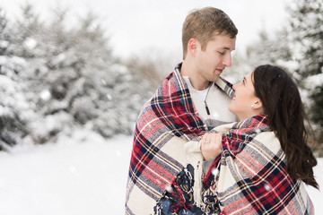 people, season, love and leisure concept - happy couple hugging and laughing outdoors in winter. Romantic couple in love feeling happiness romance spending Christmas , Valentine . love copy space.