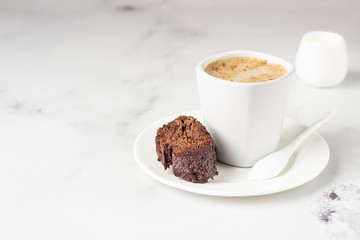 Traditional Italian homemade biscotti cookies or cantuccini with chocolate and a cup of coffee on a...