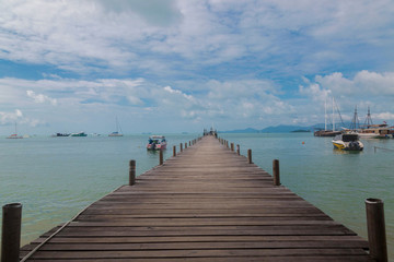 Fototapeta na wymiar Old wooden pier in the sea.