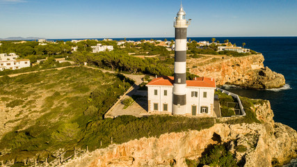 Fototapeta na wymiar lighthouse in the Bay of Cala Portocolom Mallorca Spain