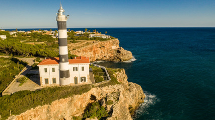 Fototapeta na wymiar lighthouse in the Bay of Cala Portocolom Mallorca Spain