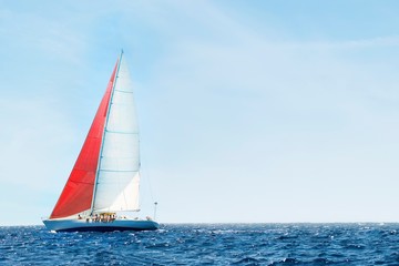 Sailboat In The Peaceful Blue Ocean