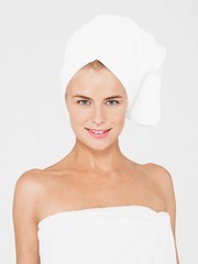 Young Woman With Body And Head Wrapped In Towels