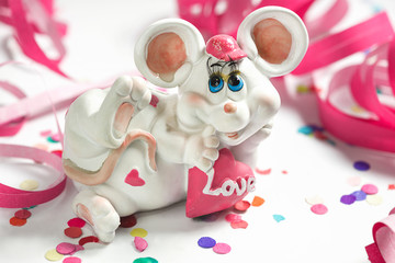 Fanny white mouse with heart on the festive white background; Symbol of chinese new year