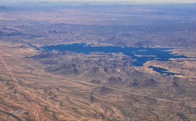 Fototapeta na wymiar Arizona Rocky Mountains Aerial view from airplane of abstract Landscapes, peaks, canyons and rural cities flying in to Phoenix, AZ. United States of America. USA.