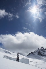 Naklejka na ściany i meble Mountain Climber Standing On Snowy Slope