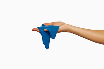 Blue slime in hand, isolated on white.