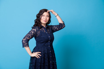 Portrait of a beautiful fashionable Asian woman in a blue dress