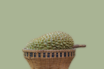 Durian in a basket with soft green background.
