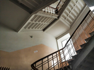 Top view on the flight of stairs of a tall old building