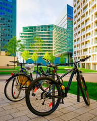 Fototapeta premium Bicycles parked at Modern apartment residential and flat building Vienna reflex