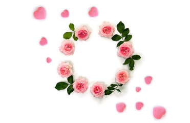 Decoration of Valentine Day. Frame of beautiful flowers pink roses and pink hearts with space for text on white background. Top view, flat lay