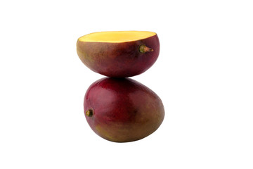 Ripe mango with half isolated on white background.