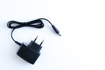Black power cord with euro plug on a white background.