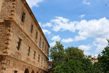 Fototapeta na wymiar Old venetian palace in Nafplio, Greece under blue sky